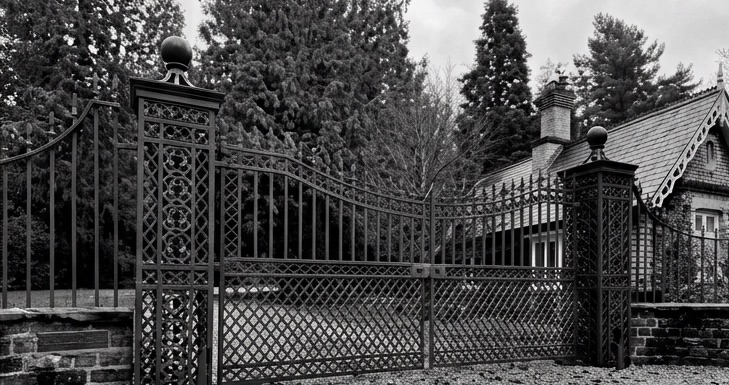 Iron gates in front of a period lodge
